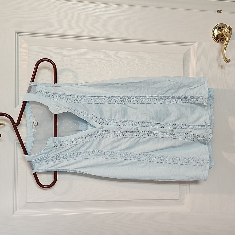 Pale blue sleeveless summer top with lace inset and dotted Swiss accent on back